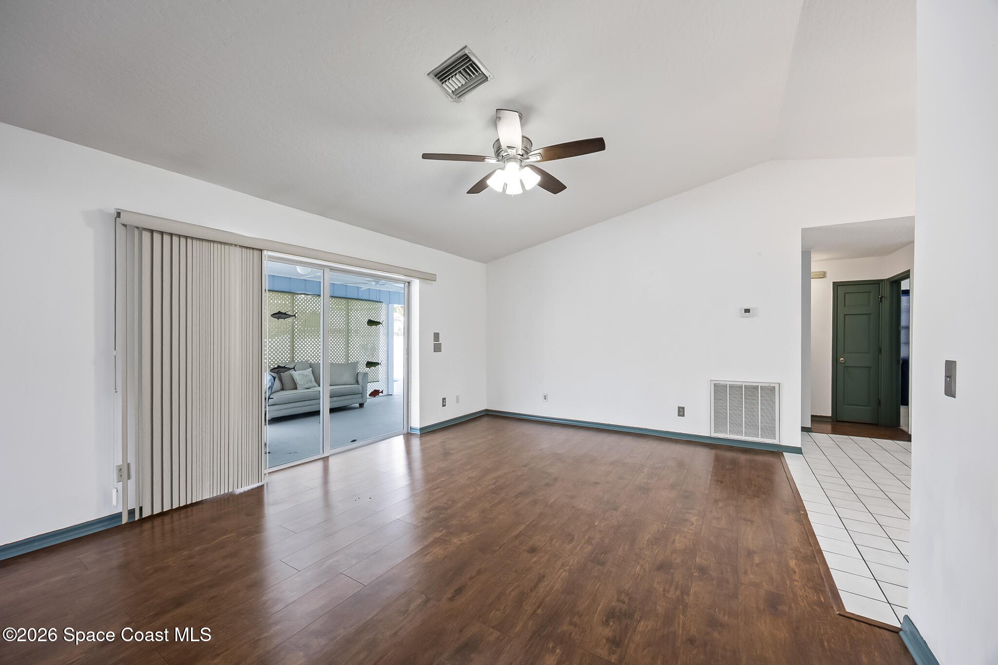 854 Dale Circle Sebastian, FL 32958 - Photo 5 of 31 wooden floor in an empty room with a window