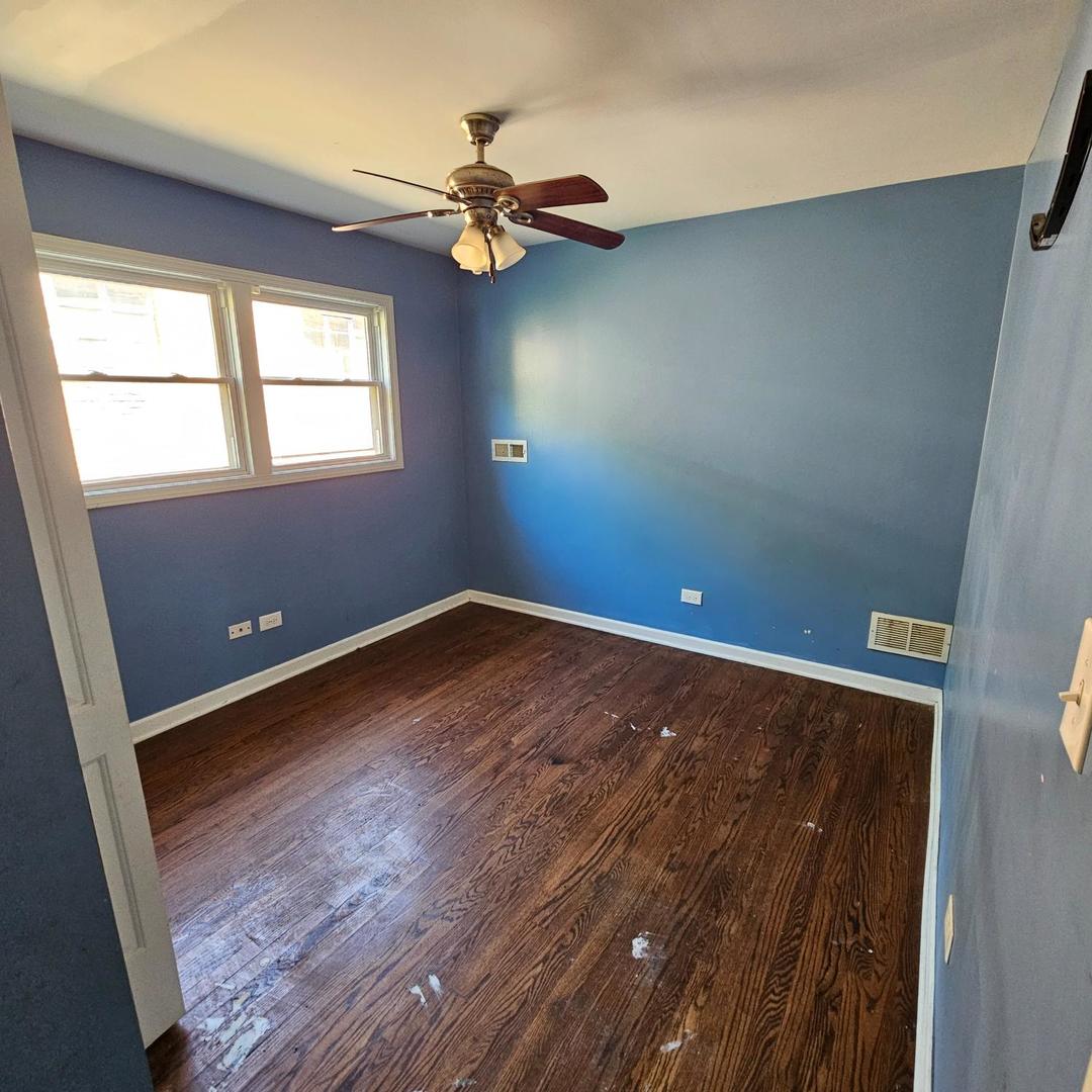 14237 Minerva Avenue Dolton, IL 60419 - Photo 7 of 17 a view of an empty room with a window