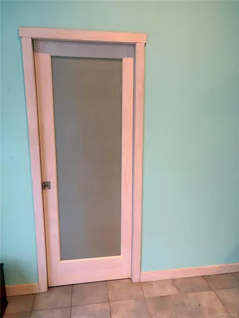 a view of room with a fan and a projector