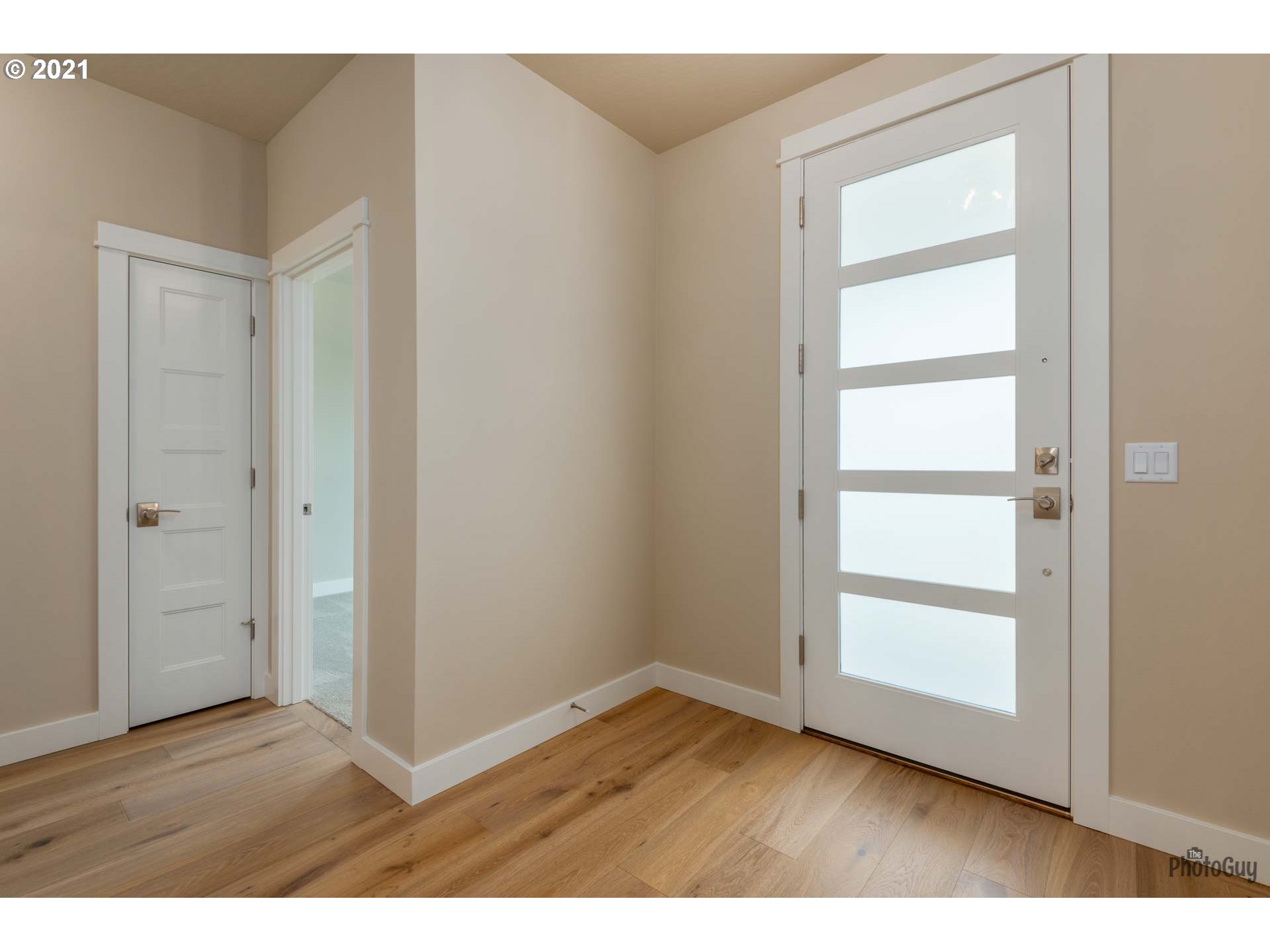 962 South 46th Street Springfield, OR 97478 - Photo 3 of 32 a view of an empty room with closet and wooden floor