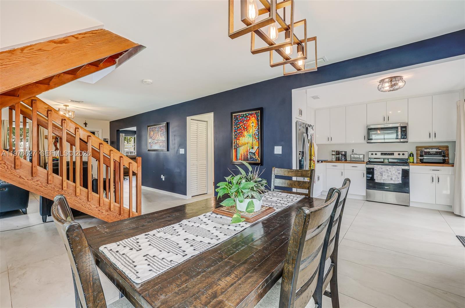 a dining room with furniture and wooden floor