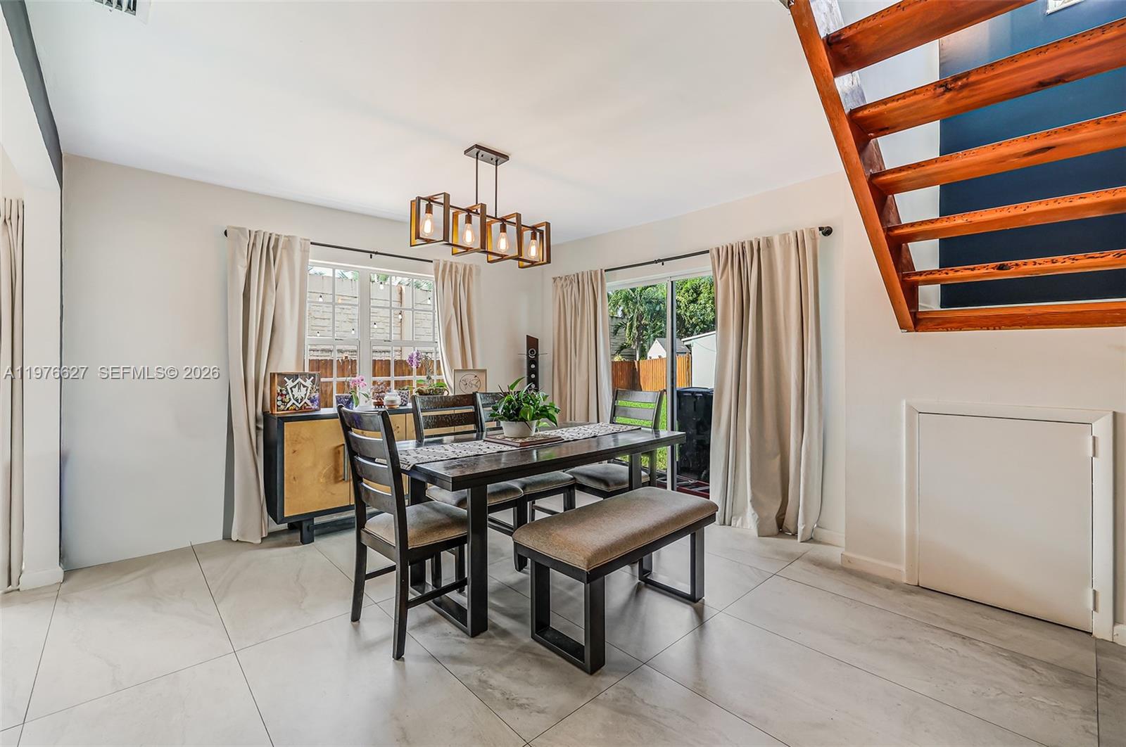 11747 Southwest 113th Terrace Miami, FL 33186 - Photo 14 of 46 a view of a livingroom with furniture and window
