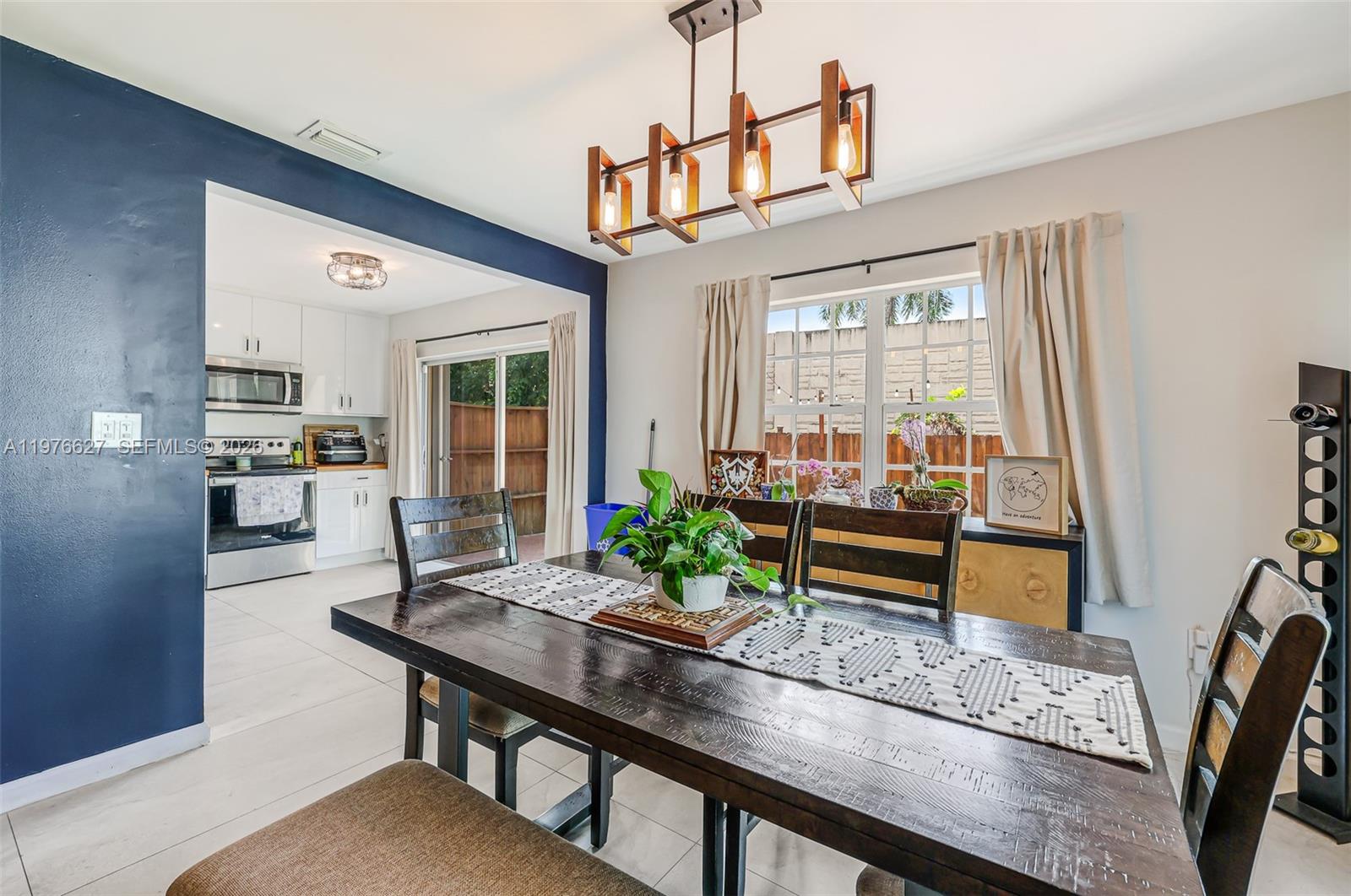 11747 Southwest 113th Terrace Miami, FL 33186 - Photo 15 of 46 a dining room with furniture and window