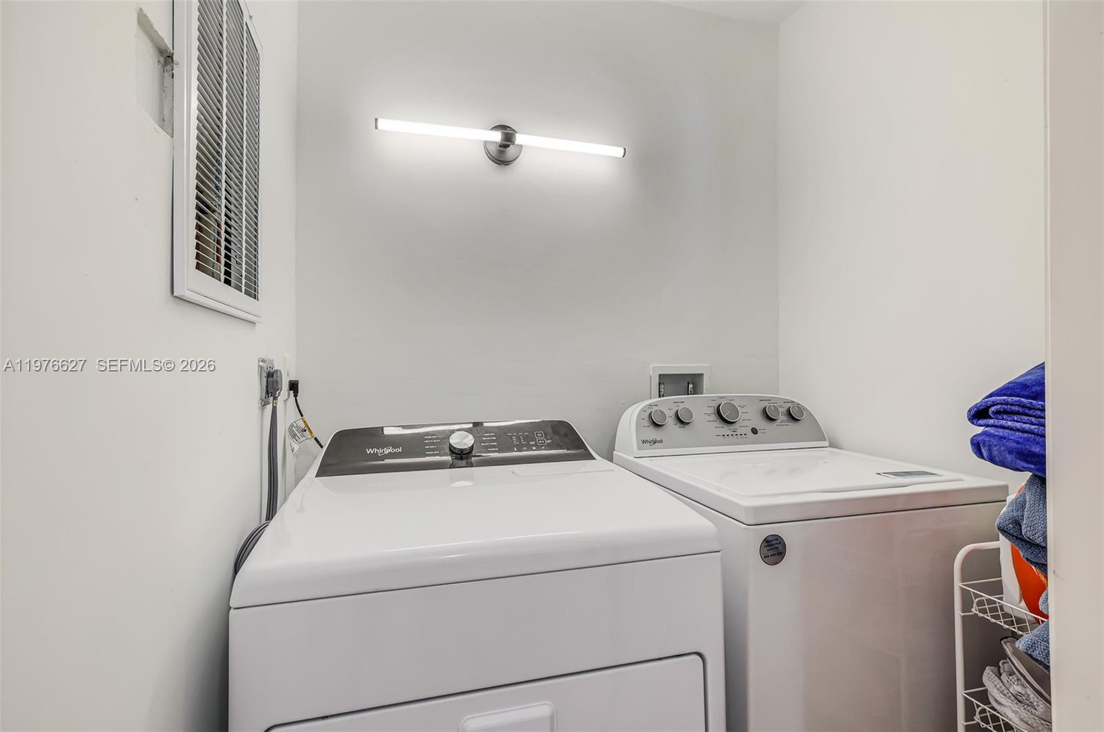 11747 Southwest 113th Terrace Miami, FL 33186 - Photo 20 of 46 a utility room with dryer and washer