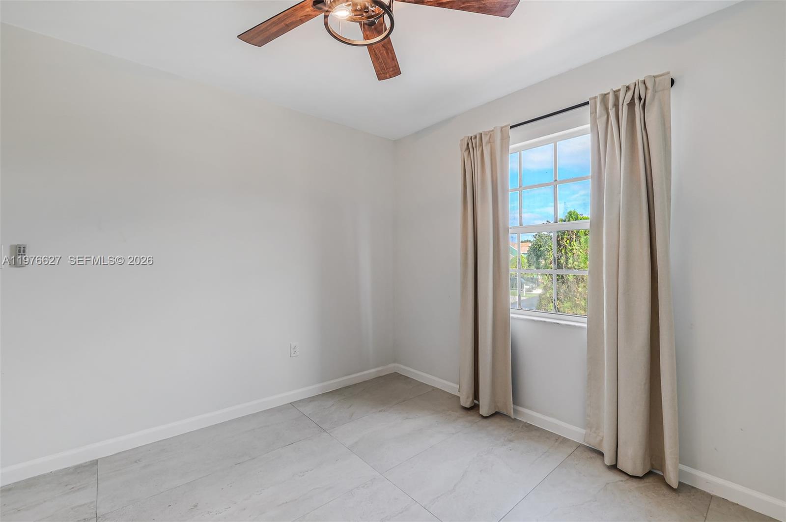 11747 Southwest 113th Terrace Miami, FL 33186 - Photo 26 of 46 an empty room with windows