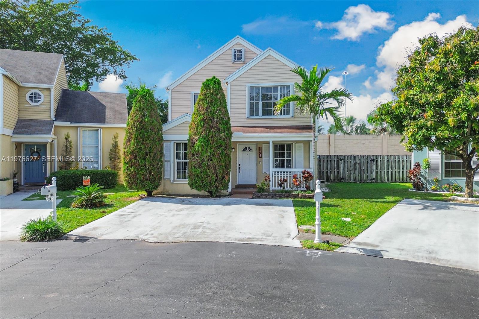 11747 Southwest 113th Terrace Miami, FL 33186 - Photo 3 of 46 a front view of a house with garden