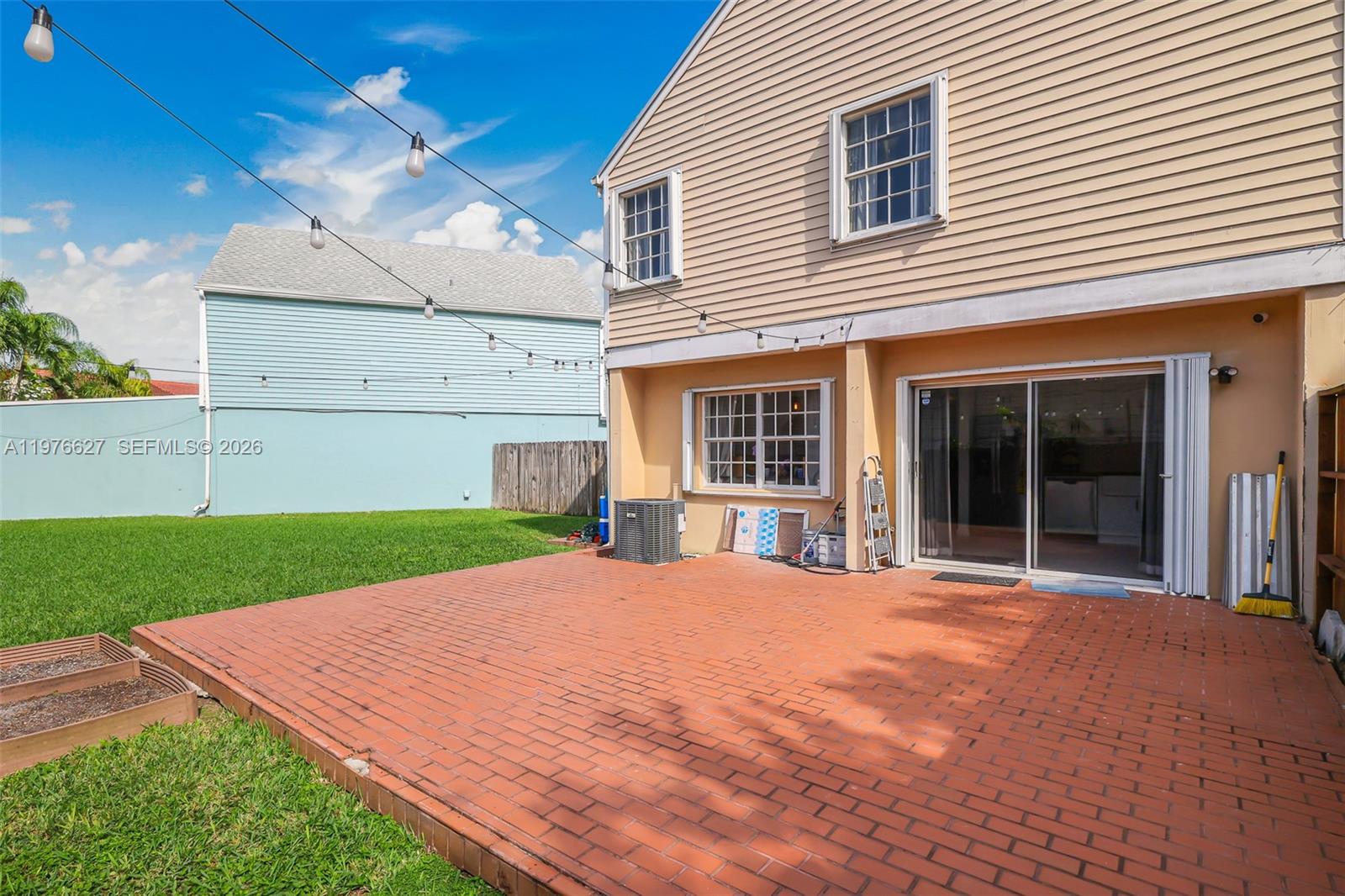 11747 Southwest 113th Terrace Miami, FL 33186 - Photo 31 of 46 a view of a house with a yard and potted plants