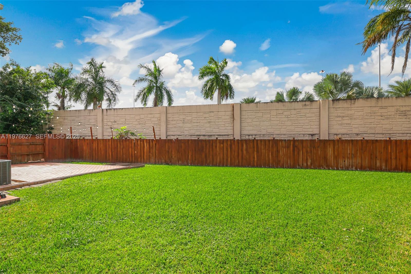 11747 Southwest 113th Terrace Miami, FL 33186 - Photo 33 of 46 a view of a yard with wooden fence