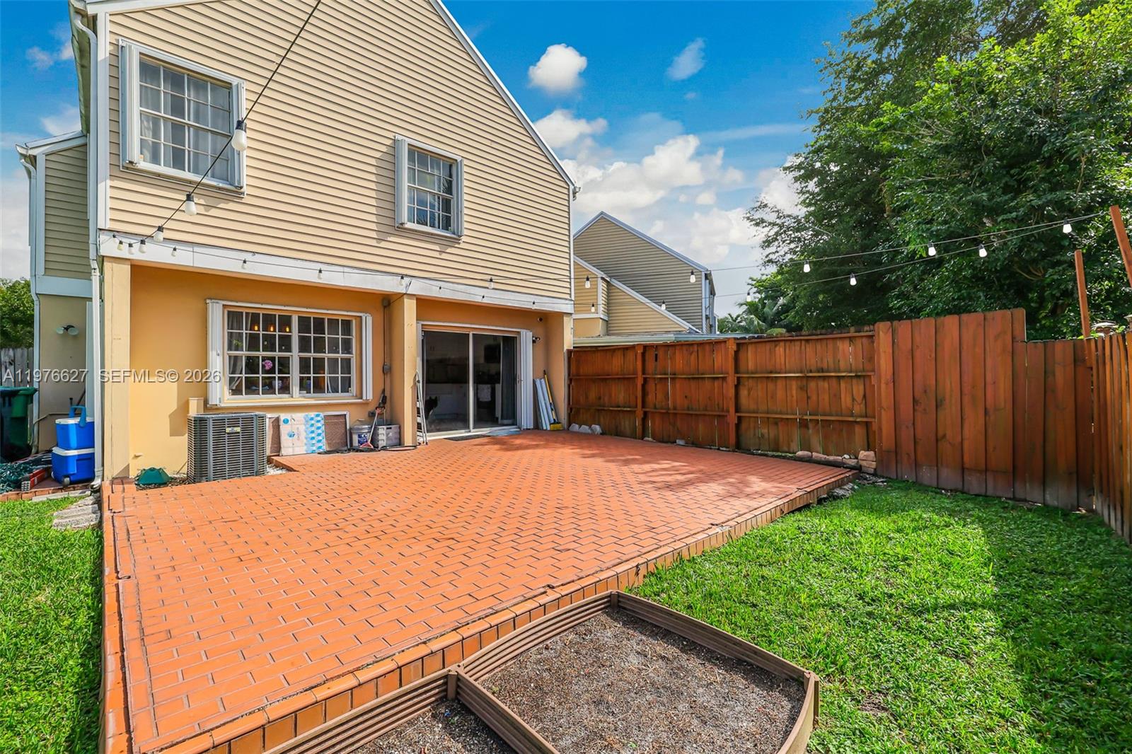 11747 Southwest 113th Terrace Miami, FL 33186 - Photo 35 of 46 a view of backyard with wooden fence and large trees