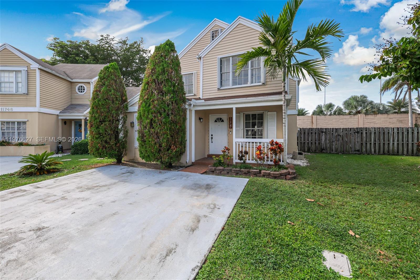 11747 Southwest 113th Terrace Miami, FL 33186 - Photo 4 of 46 a view of a house with a yard and potted plants