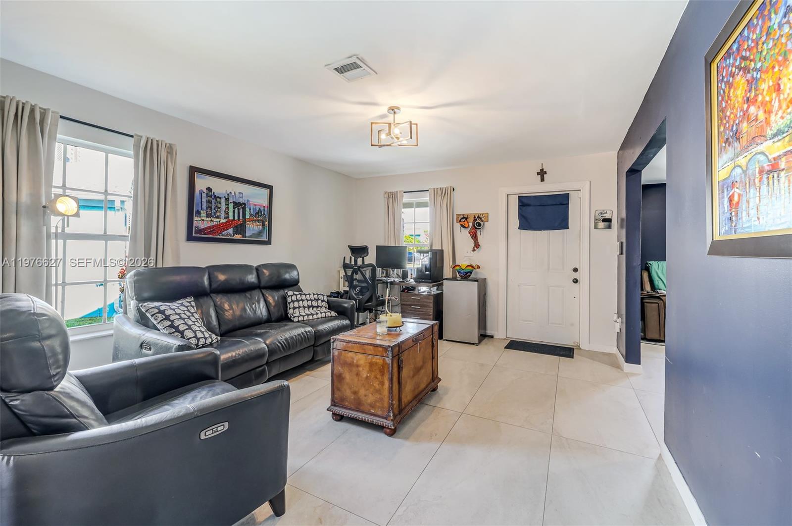 11747 Southwest 113th Terrace Miami, FL 33186 - Photo 6 of 46 a living room with furniture and a window
