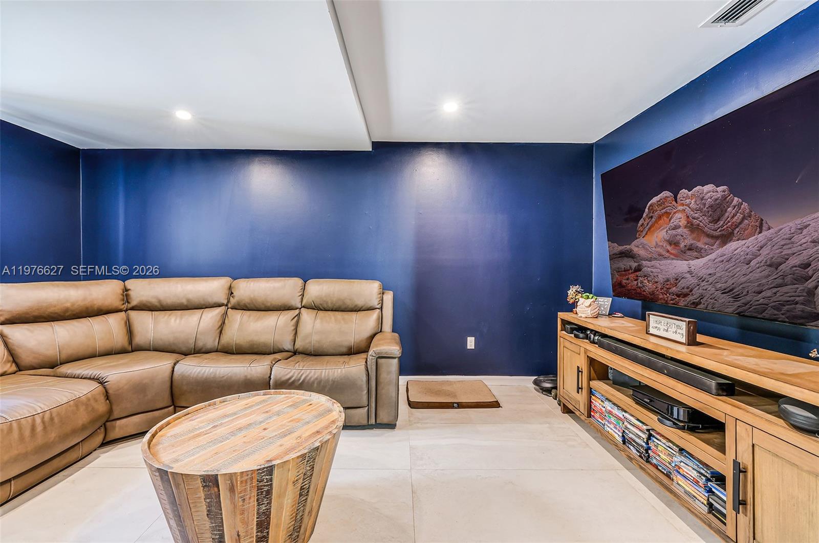 11747 Southwest 113th Terrace Miami, FL 33186 - Photo 10 of 46 a living room with furniture and a wooden floor