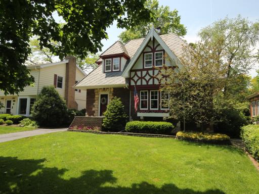 726 Howard Street Wheaton, IL 60187 - Photo 1 of 16 a front view of a house with a yard and trees