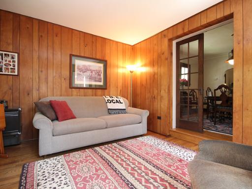726 Howard Street Wheaton, IL 60187 - Photo 9 of 16 a living room with furniture and a rug