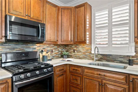 a kitchen with a sink and a window