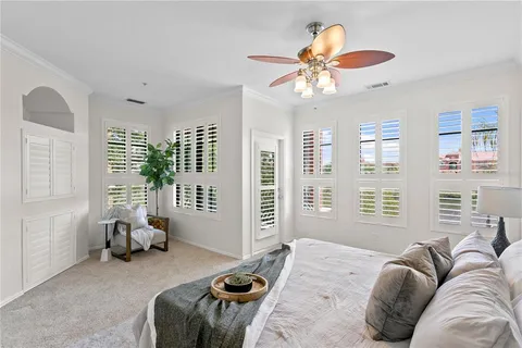 a large white kitchen with a sink and a large mirror