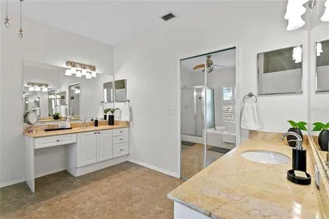 a bathroom with a bathtub and a window