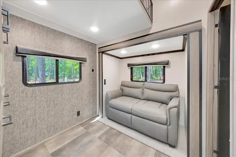 a living room with furniture and a window