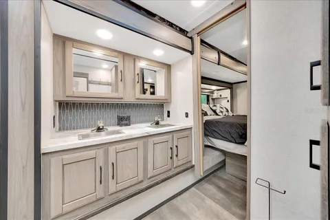 a en suite bathroom with a sink and a mirror