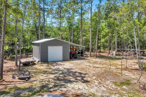 a view of a backyard with large trees