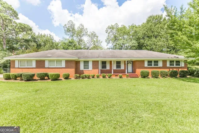 front view of a house and a yard