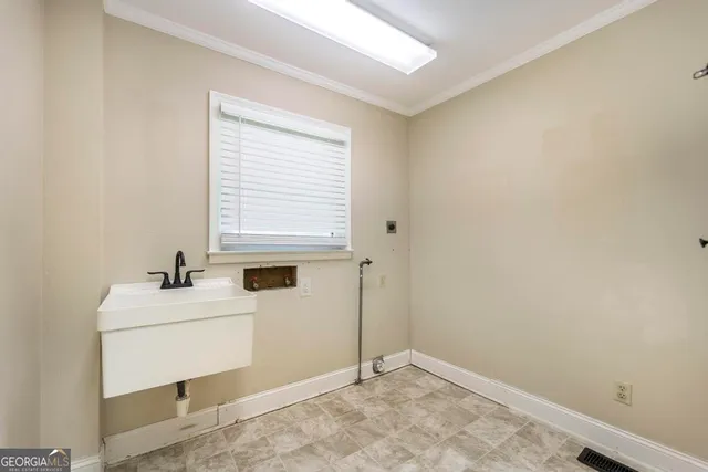 a bathroom with a sink mirror and toilet