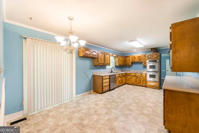 a bedroom with furniture and a chandelier