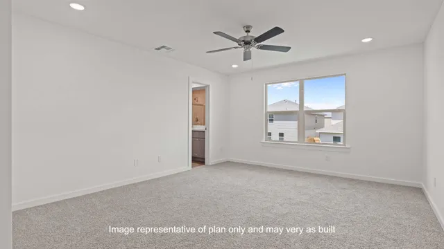 a view of an empty room and a window