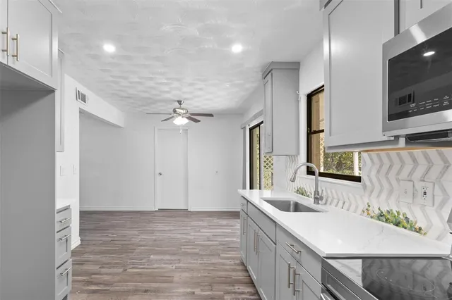 a bathroom with a double vanity sink a mirror and shower