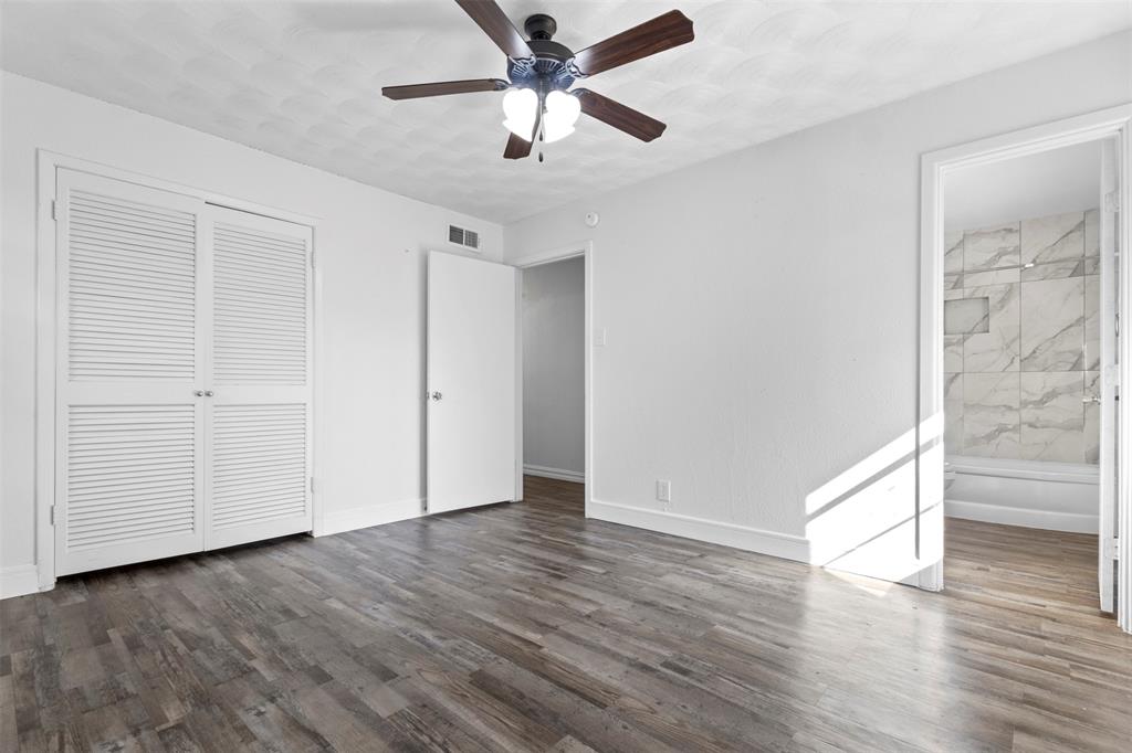 1809 Balla Way Grand Prairie, TX 75051 - Photo 16 of 26 wooden floor in an empty room with a window