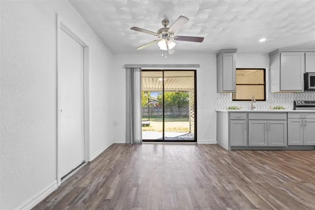 a view of a kitchen with a sink and a window