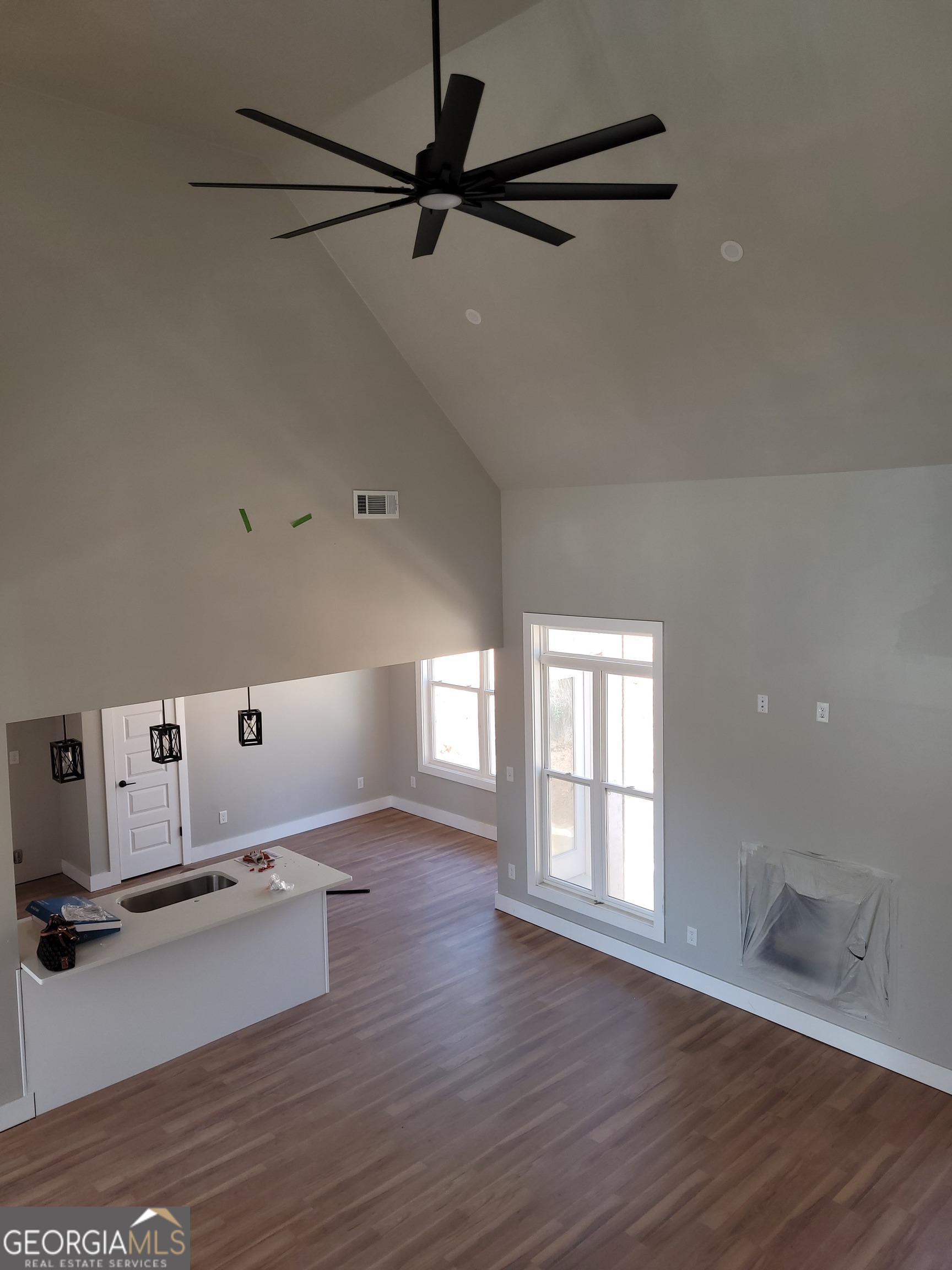 2910 Battlecrest Drive Decatur, GA 30034 - Photo 12 of 12 a room with a wooden floor and white walls