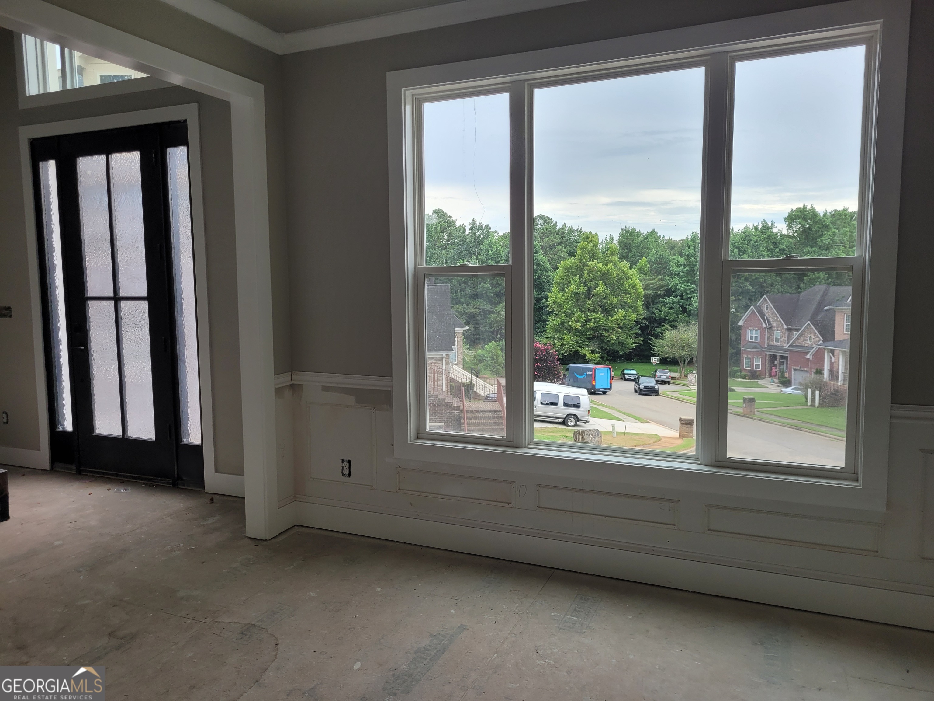 2910 Battlecrest Drive Decatur, GA 30034 - Photo 4 of 10 a view of an empty room with large windows and a bed