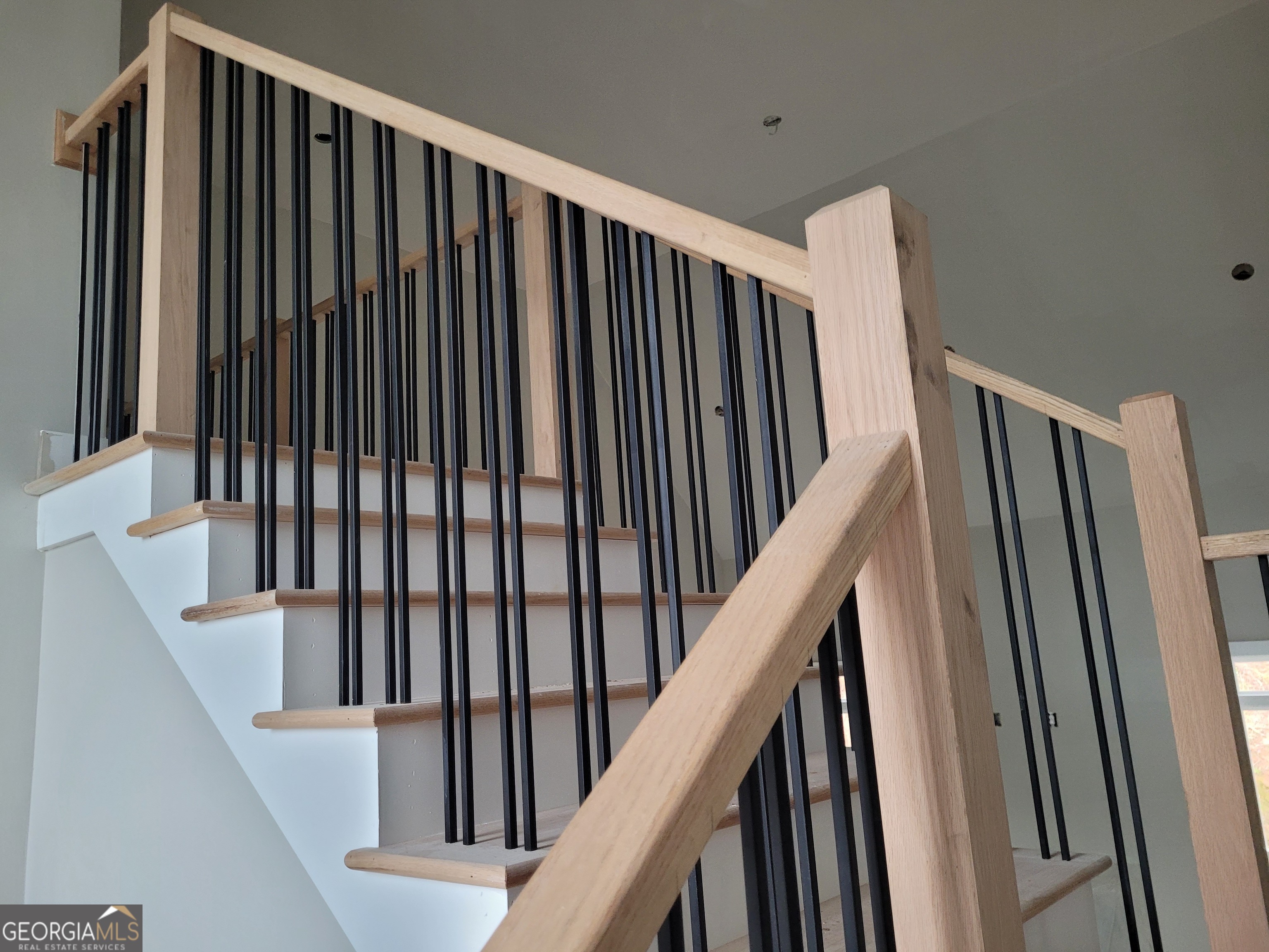 2910 Battlecrest Drive Decatur, GA 30034 - Photo 8 of 10 a view of staircase with railing and white walls