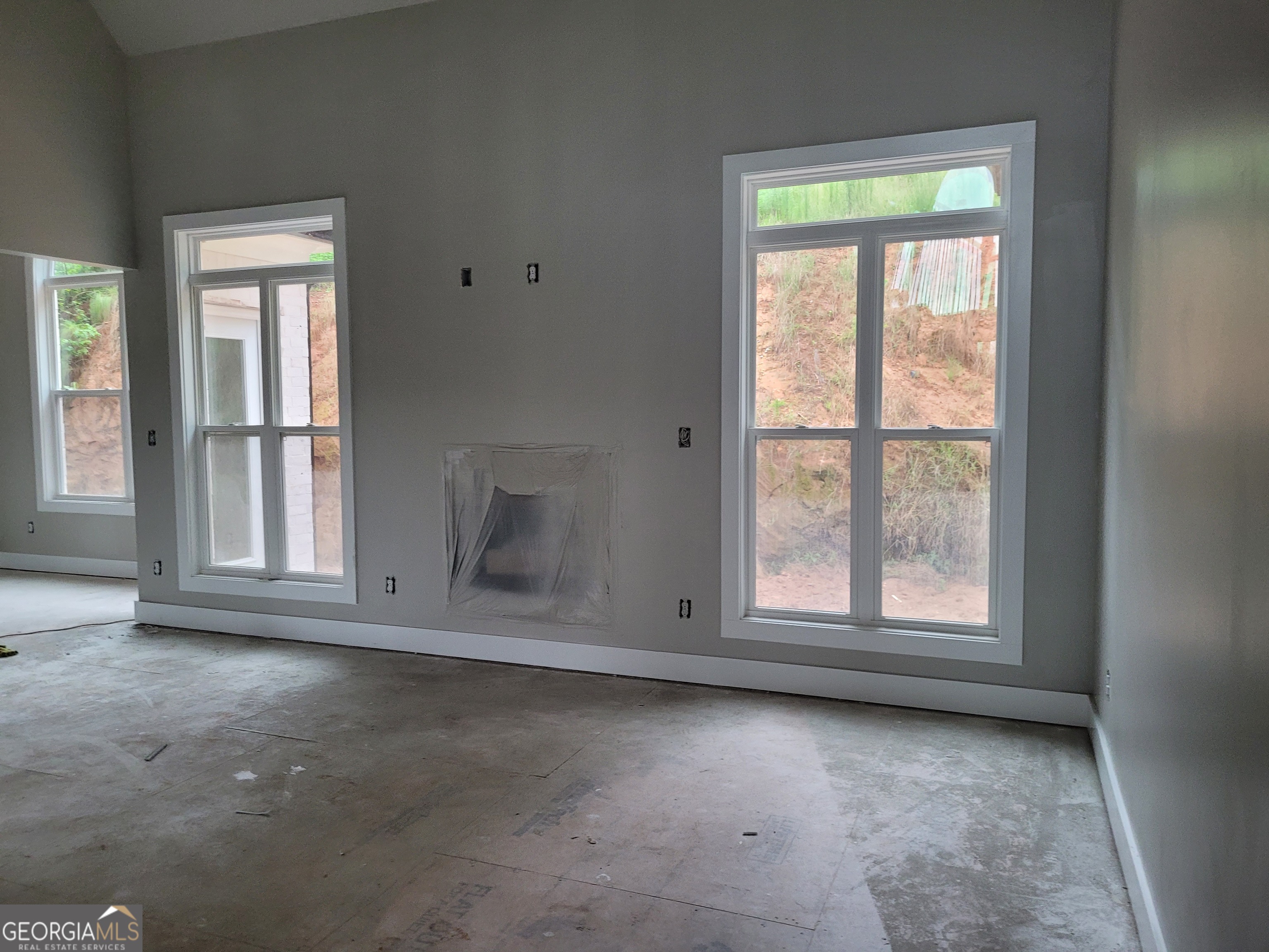 2910 Battlecrest Drive Decatur, GA 30034 - Photo 10 of 10 an empty room with wooden floor and windows