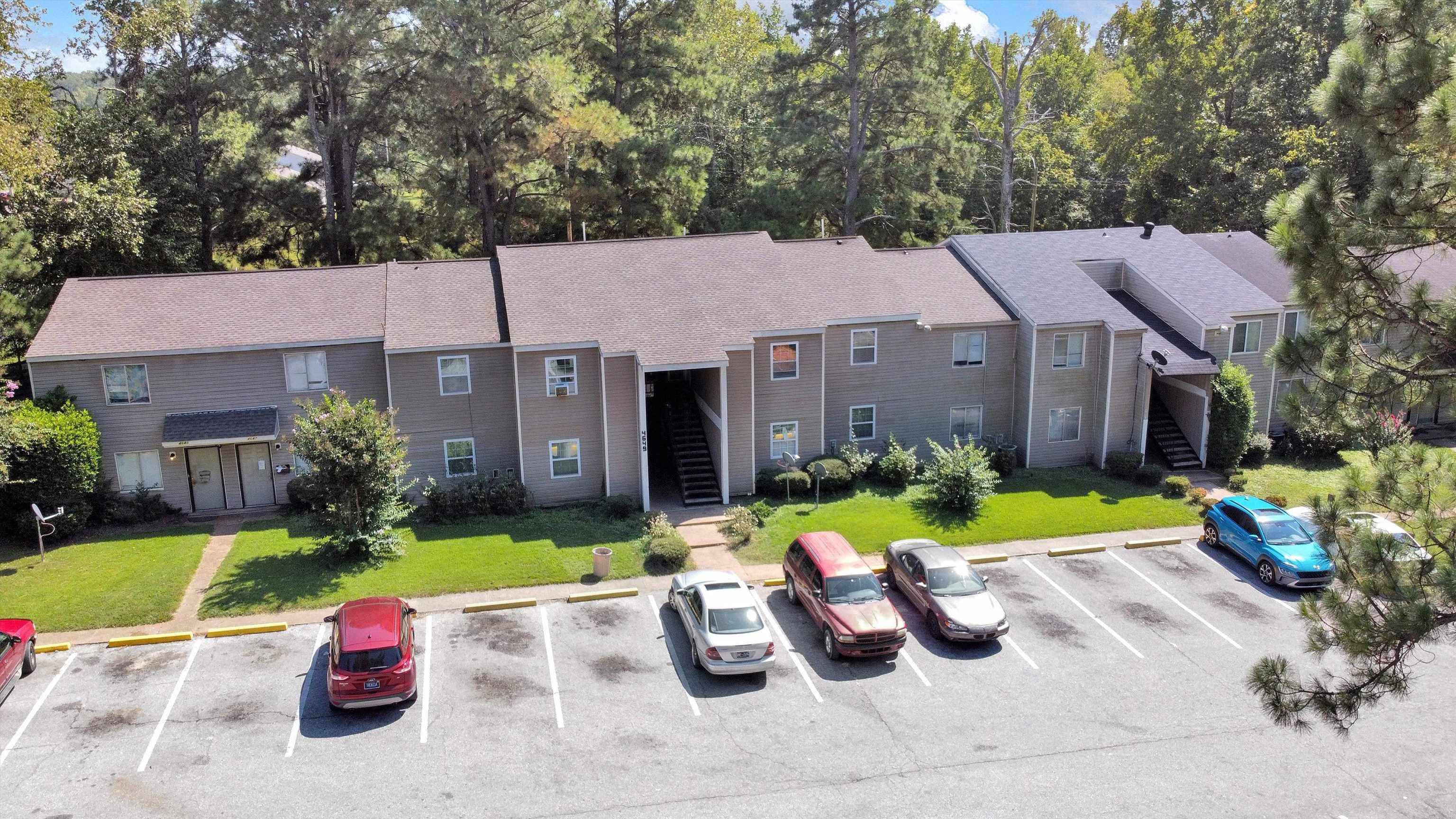 a view of a house with backyard sitting area and garden