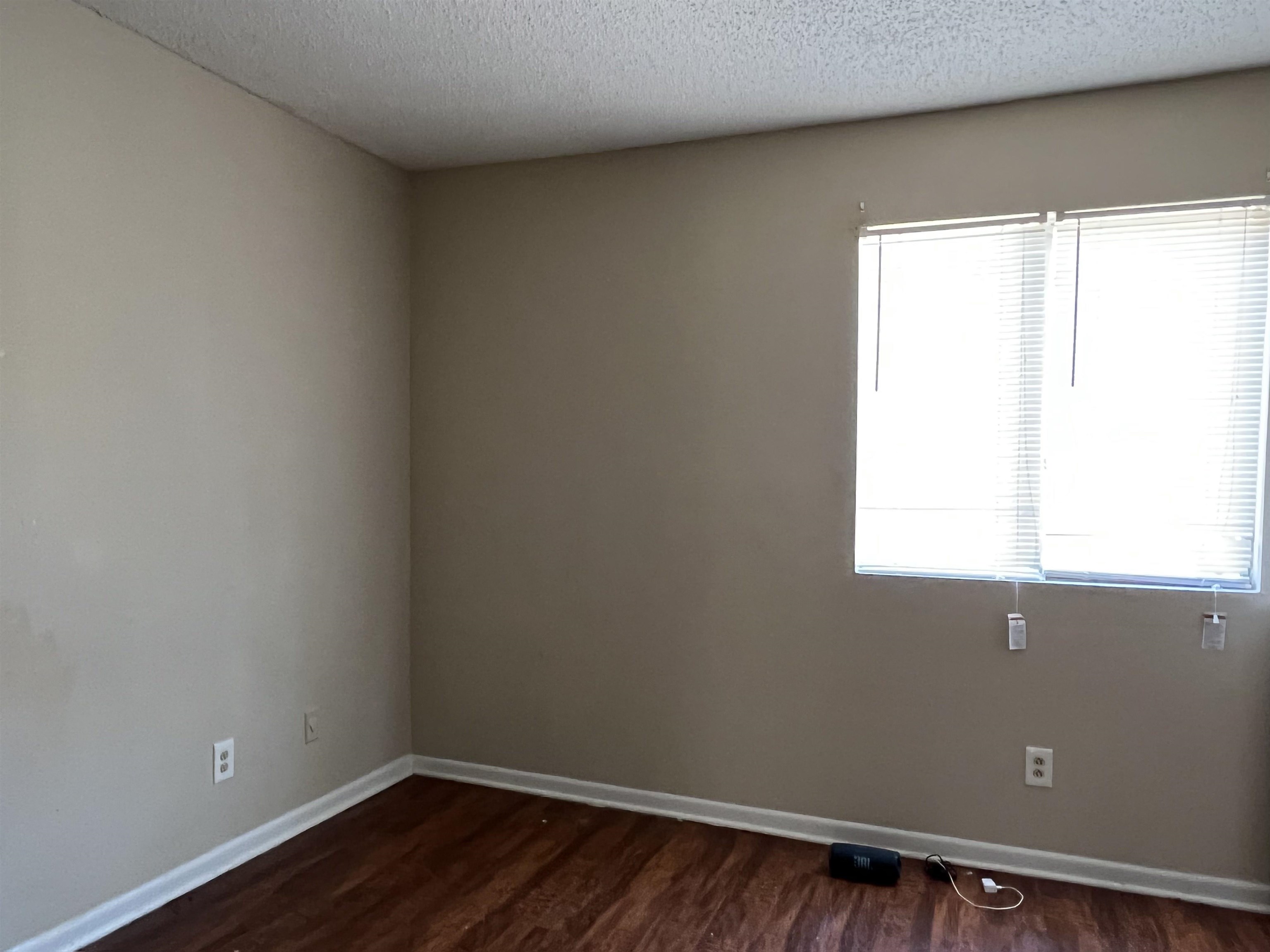 4651 Royal Ridge Drive Memphis, TN 38128 - Photo 8 of 13 a view of a small space with wooden floor and a window