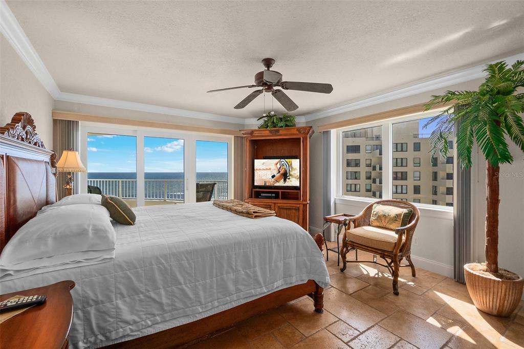 2937 South Atlantic Avenue, Unit 1907 Daytona Beach Shores, FL 32118 - Photo 12 of 55 a bedroom with a bed and large windows