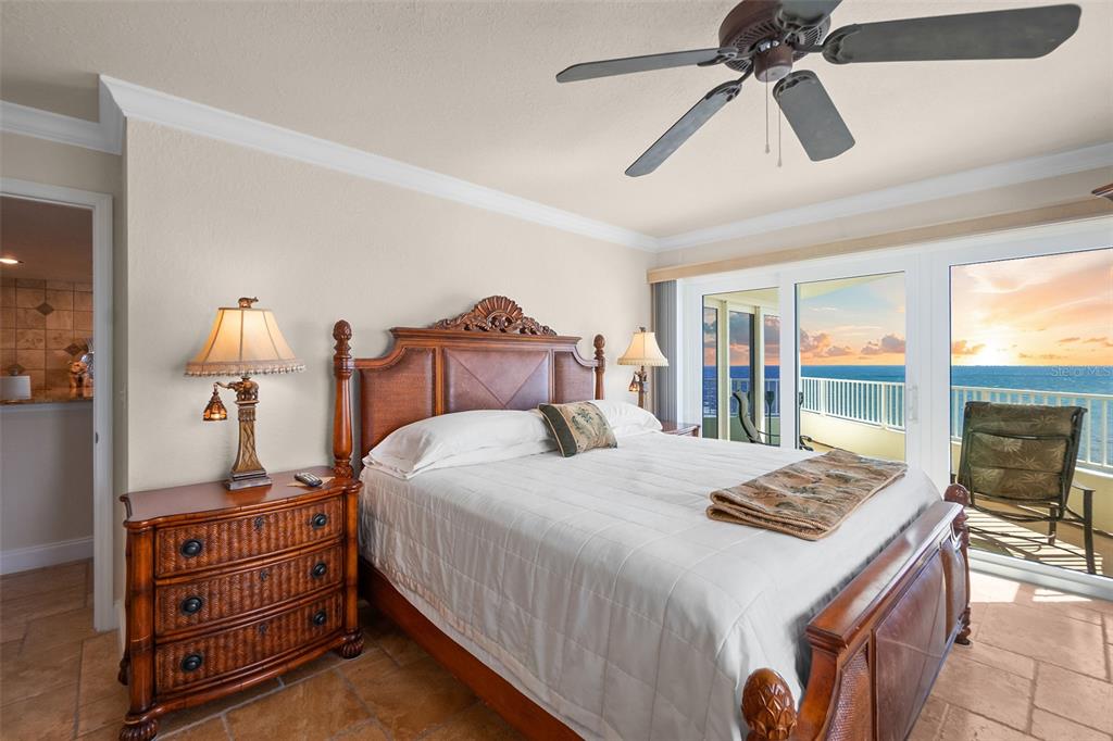 2937 South Atlantic Avenue, Unit 1907 Daytona Beach Shores, FL 32118 - Photo 13 of 55 a bedroom with a bed and large window