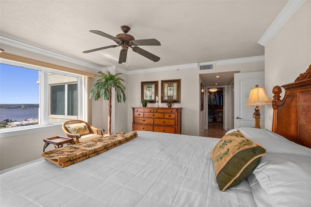 2937 South Atlantic Avenue, Unit 1907 Daytona Beach Shores, FL 32118 - Photo 16 of 55 a bedroom with a bed and ceiling fan