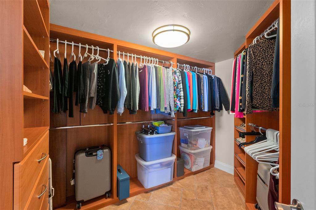 2937 South Atlantic Avenue, Unit 1907 Daytona Beach Shores, FL 32118 - Photo 17 of 55 a view of walk in closet with clothes and shoes