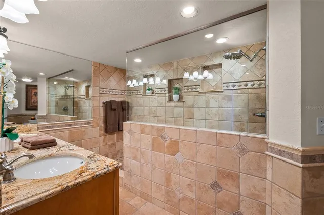 a bathroom with a sink vanity and a mirror
