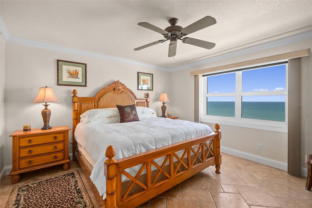2937 South Atlantic Avenue, Unit 1907 Daytona Beach Shores, FL 32118 - Photo 21 of 55 a bed room with a bed and a window