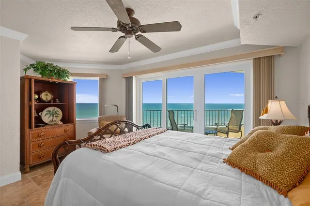 a bedroom with a bed and a couch