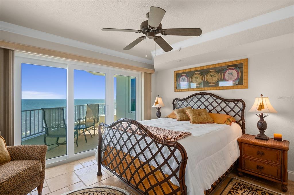2937 South Atlantic Avenue, Unit 1907 Daytona Beach Shores, FL 32118 - Photo 27 of 55 a bedroom with a bed and a couch