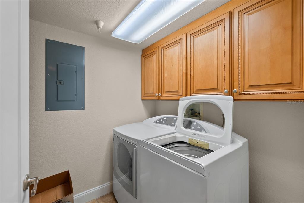 2937 South Atlantic Avenue, Unit 1907 Daytona Beach Shores, FL 32118 - Photo 31 of 55 a utility room with dryer and washer