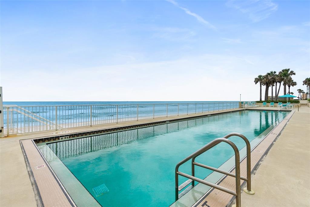 2937 South Atlantic Avenue, Unit 1907 Daytona Beach Shores, FL 32118 - Photo 35 of 55 a view of swimming pool with a couple of chairs