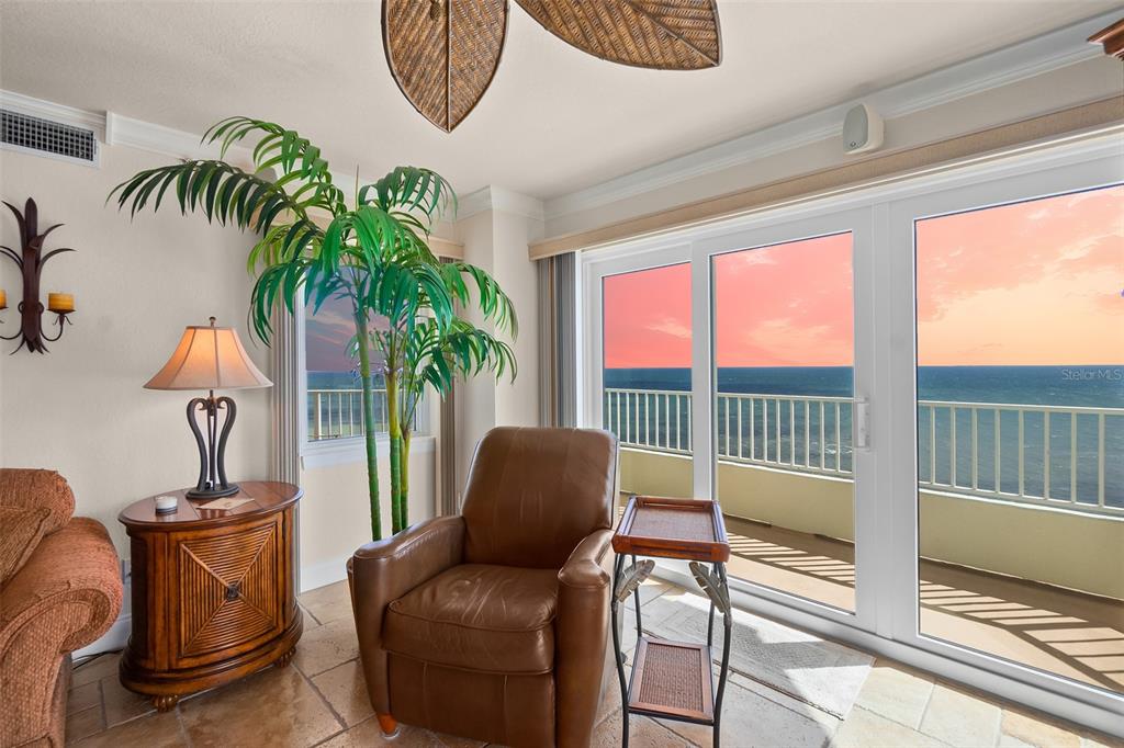 2937 South Atlantic Avenue, Unit 1907 Daytona Beach Shores, FL 32118 - Photo 4 of 55 a balcony with furniture and a potted plant