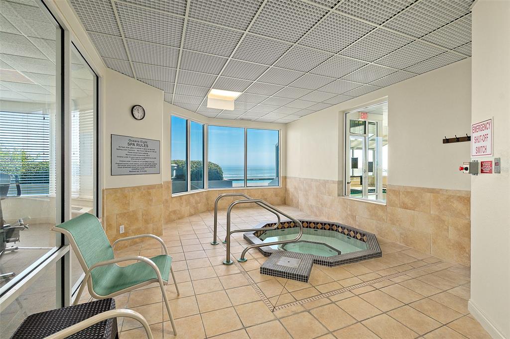 2937 South Atlantic Avenue, Unit 1907 Daytona Beach Shores, FL 32118 - Photo 42 of 55 a view of a swimming pool and lounge chair