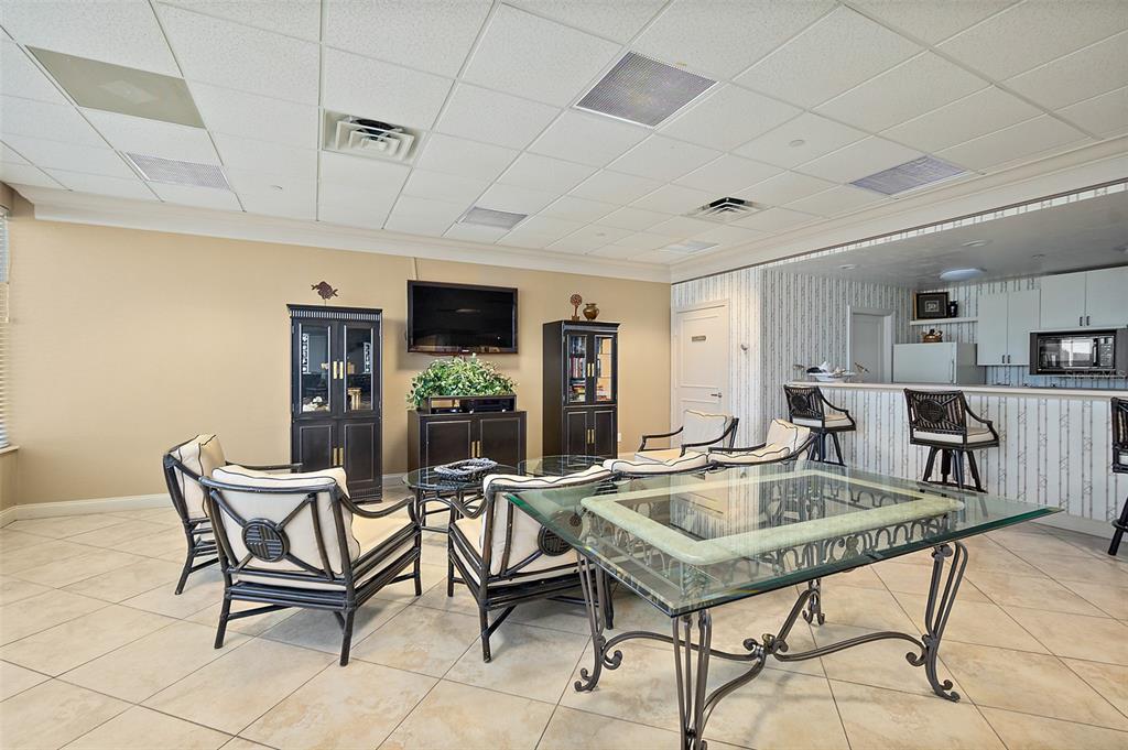 2937 South Atlantic Avenue, Unit 1907 Daytona Beach Shores, FL 32118 - Photo 47 of 55 a living room with furniture and a table